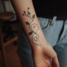 minimalist plant or vine-tattoo-wrapped-around-the-wrist